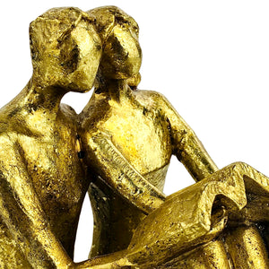 Golden Couple Reading Book Sculpture