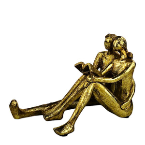 Golden Couple Reading Book Sculpture